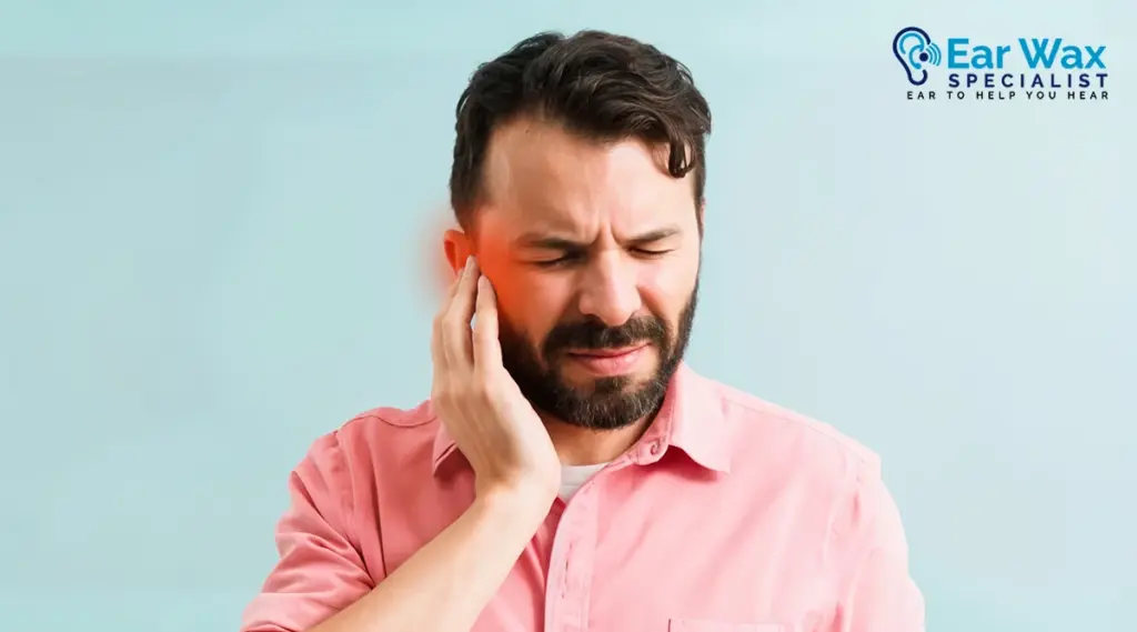 Patient receiving professional ear wax removal treatment in clinic