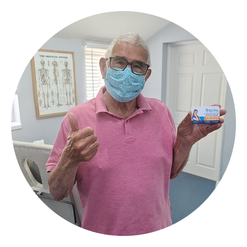 Patient with Ear Wax Specialist card.